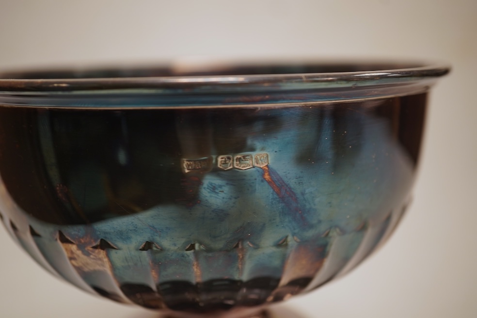 A George VI demi-fluted silver rose bowl, by Walker & Hall, Sheffield, 1939, diameter 14.4cm, 7.2oz, on an ebonised socle.